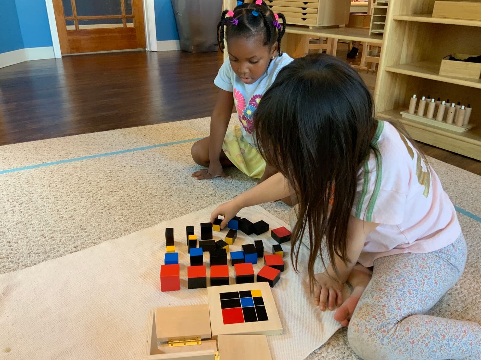 Spark learners working on the rug